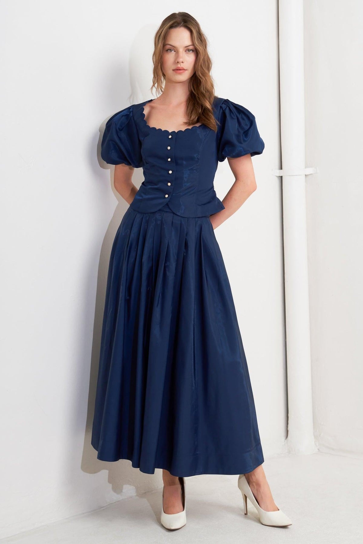 FALDA MIDI PLISADA DE TEJIDO ACAMPANADO LUXE