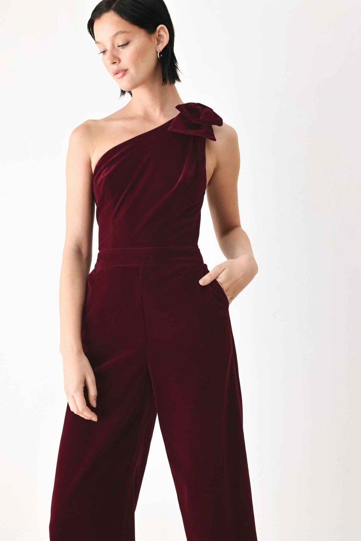 BERRY AFTER DARK VELVET BOW ONE-SHOULDER JUMPSUIT