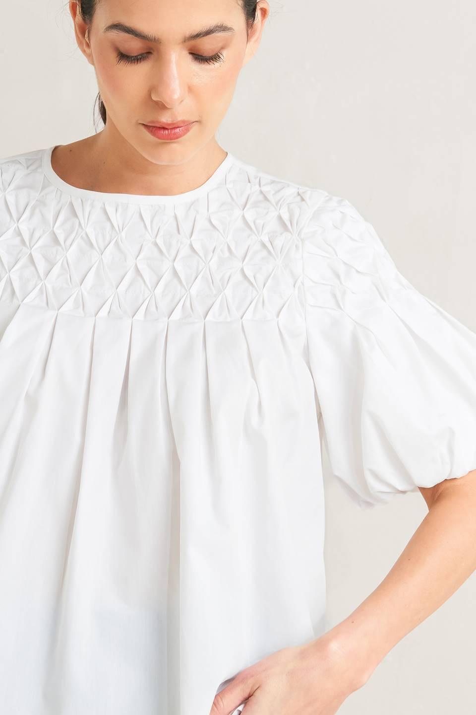 TOP TEJIDO BLANCO DE MANGAS ABULLONADAS