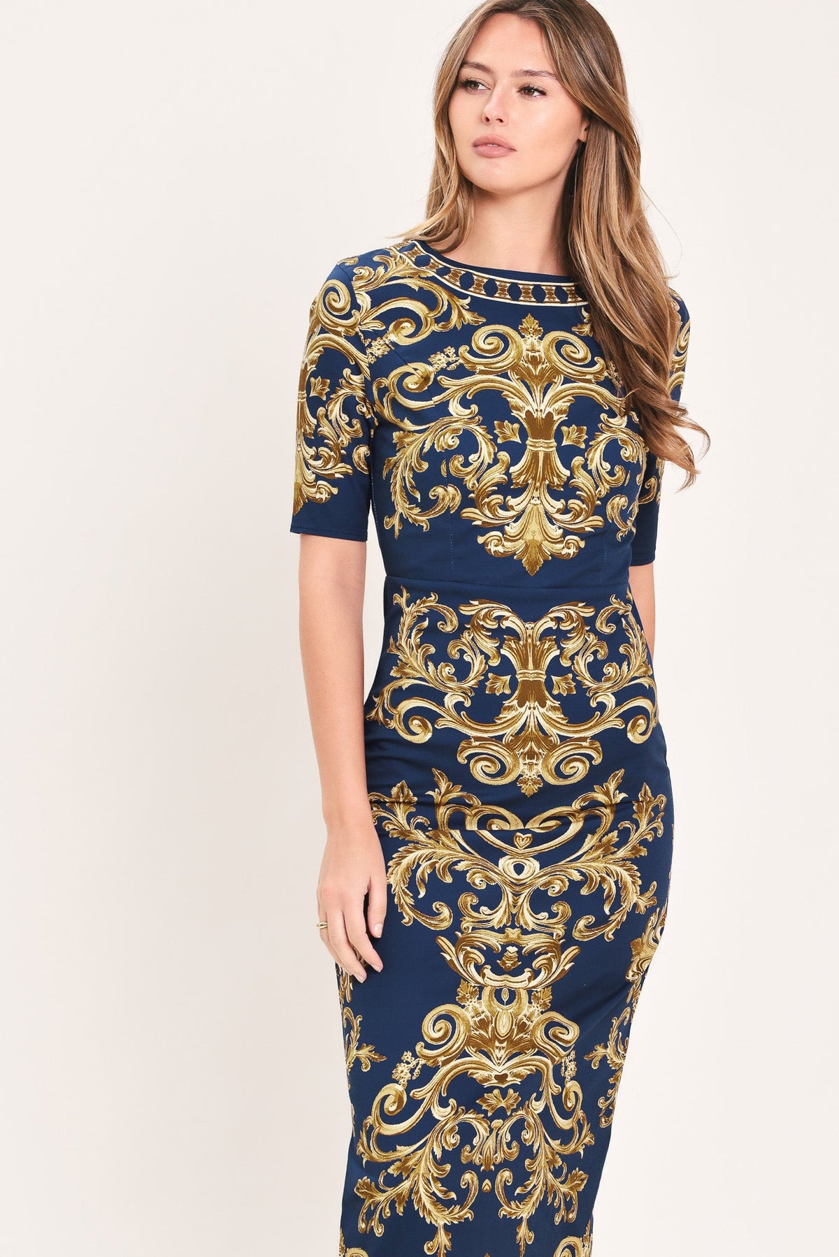 VESTIDO MIDI TEJIDO CON FLOREADOS DORADOS NOBLES