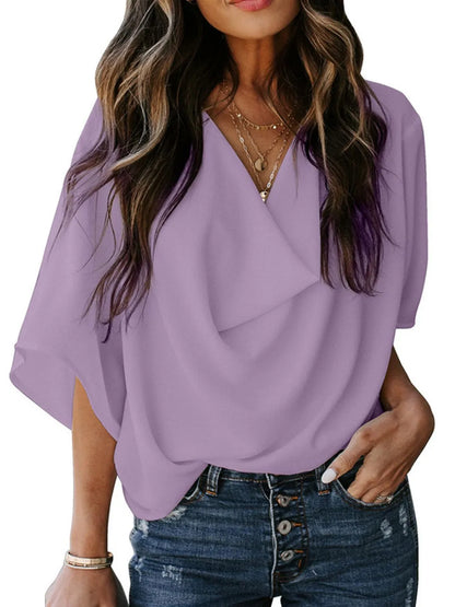 Lavender three-quarter sleeve blouse for women with V-neck and loose fit styled with denim jeans